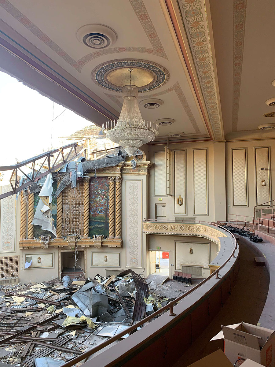 Photo showing in ceiling ornament inside damage Theatre